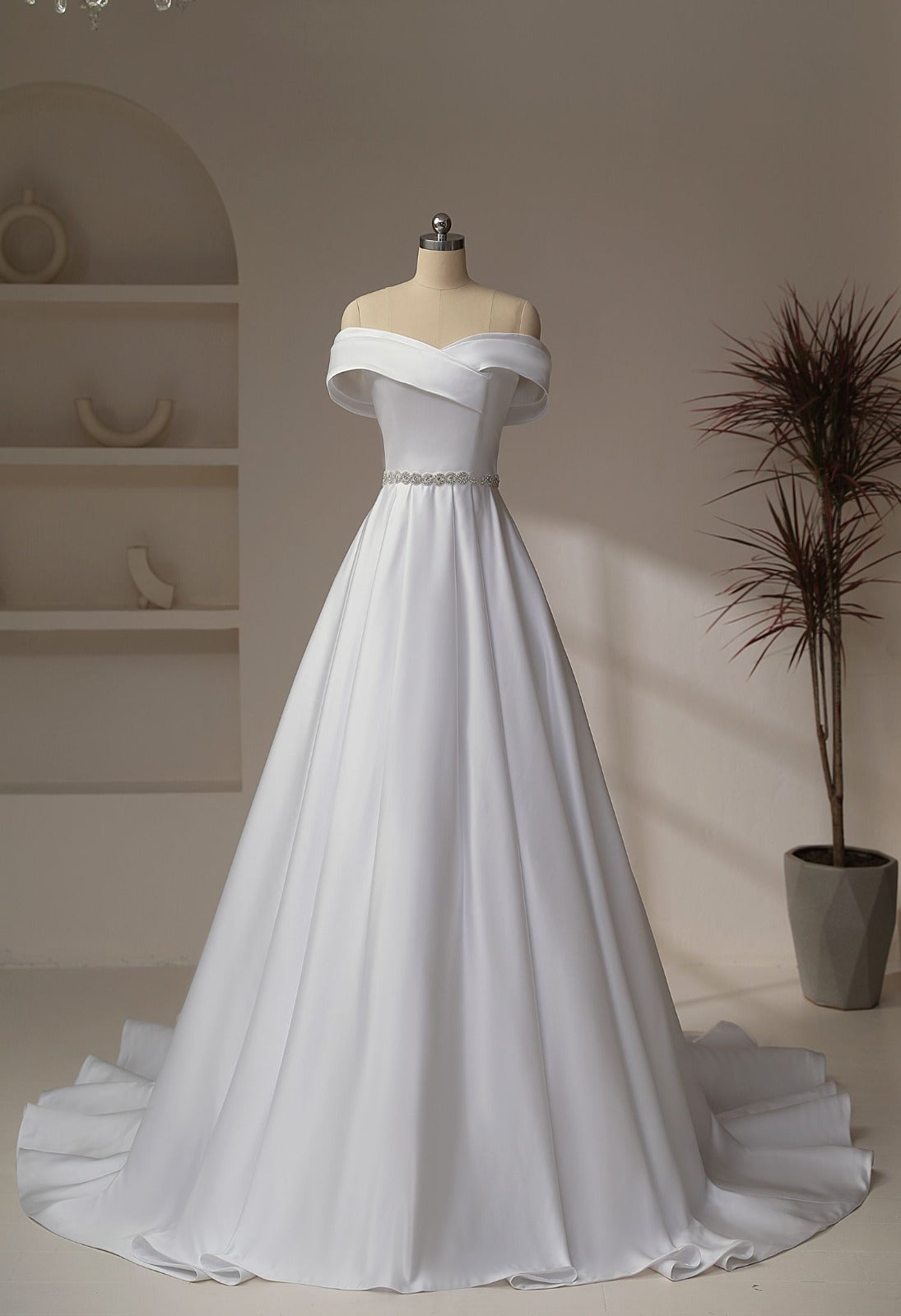 sarin wedding dress with cross over of-shoulder bodice and sparkly belt