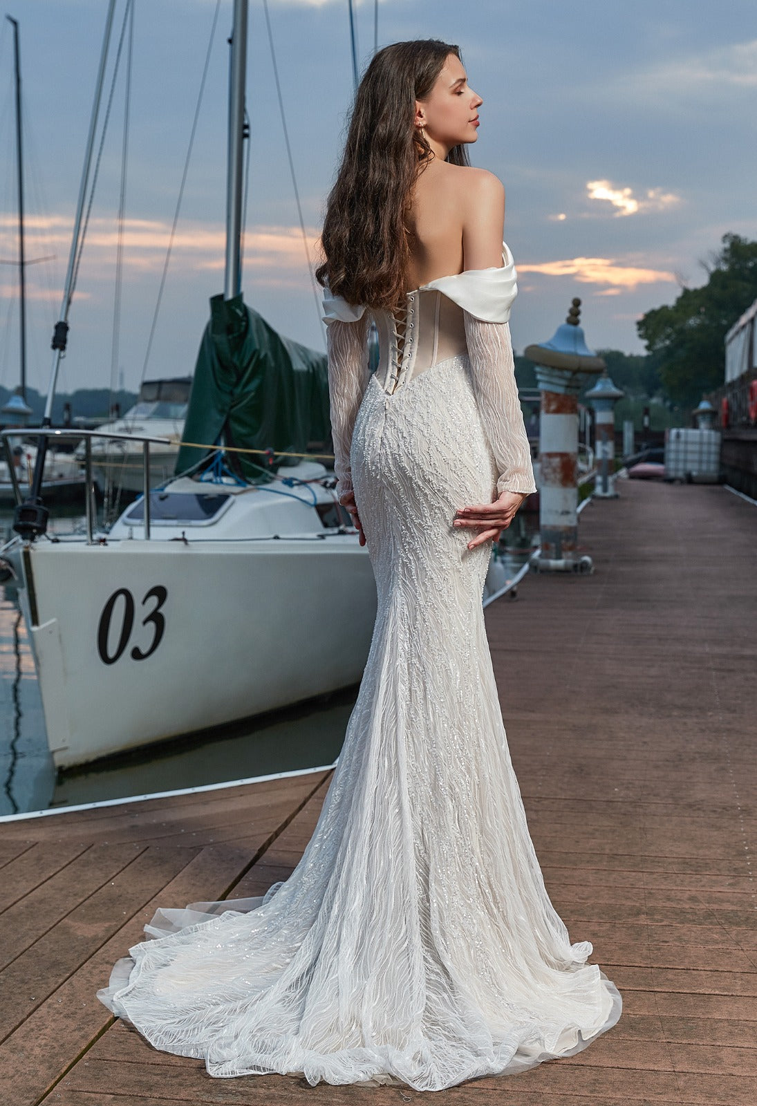 designer beaded sheath wedding dress with off-shoulder straps, detachable sleeves and overskirt