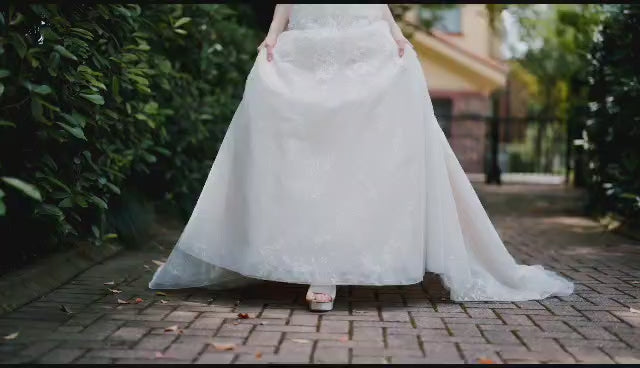 video of wedding dress with all over lace and beading and detachable sleeves